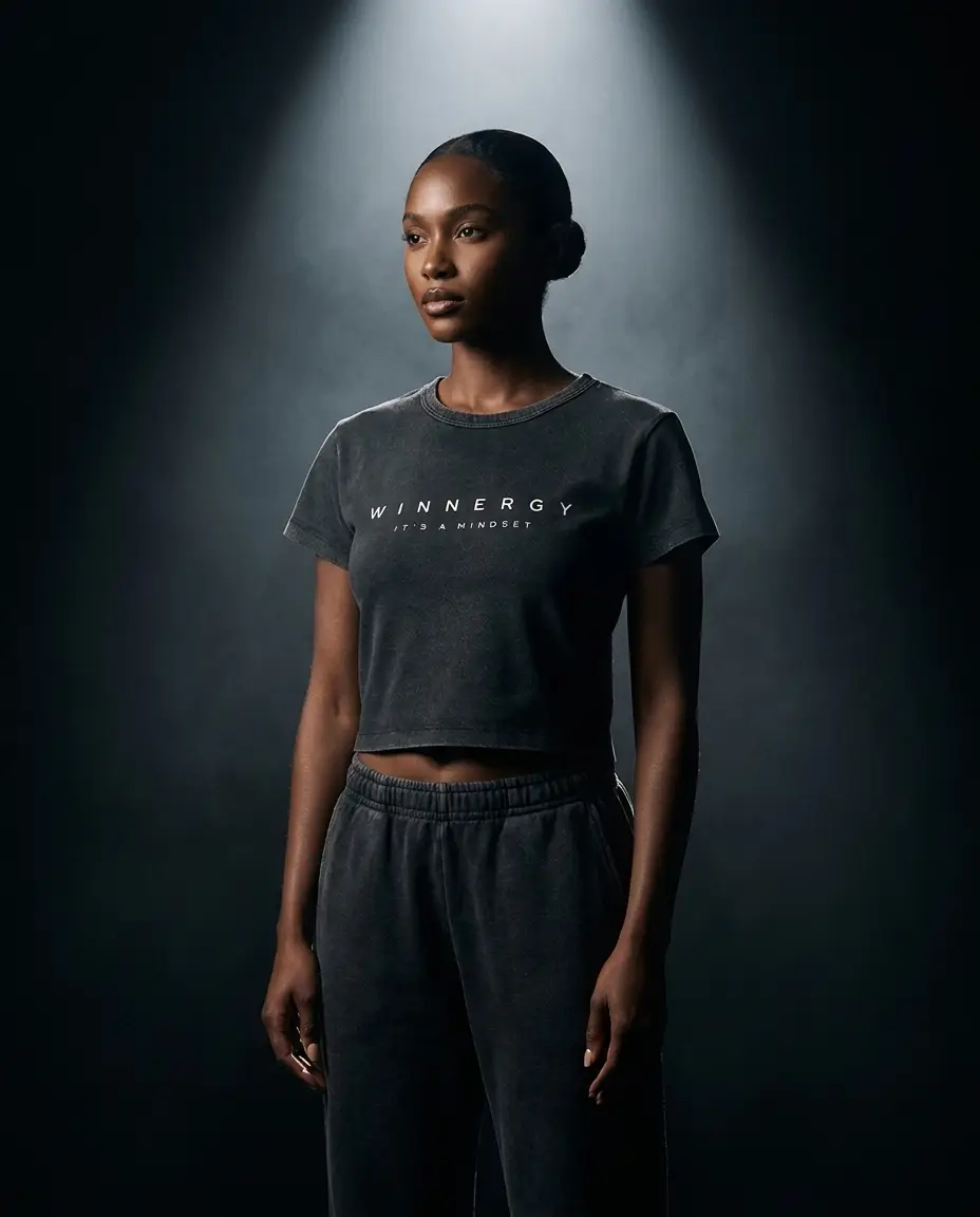 Model wearing the Winnergy black cropped tee
